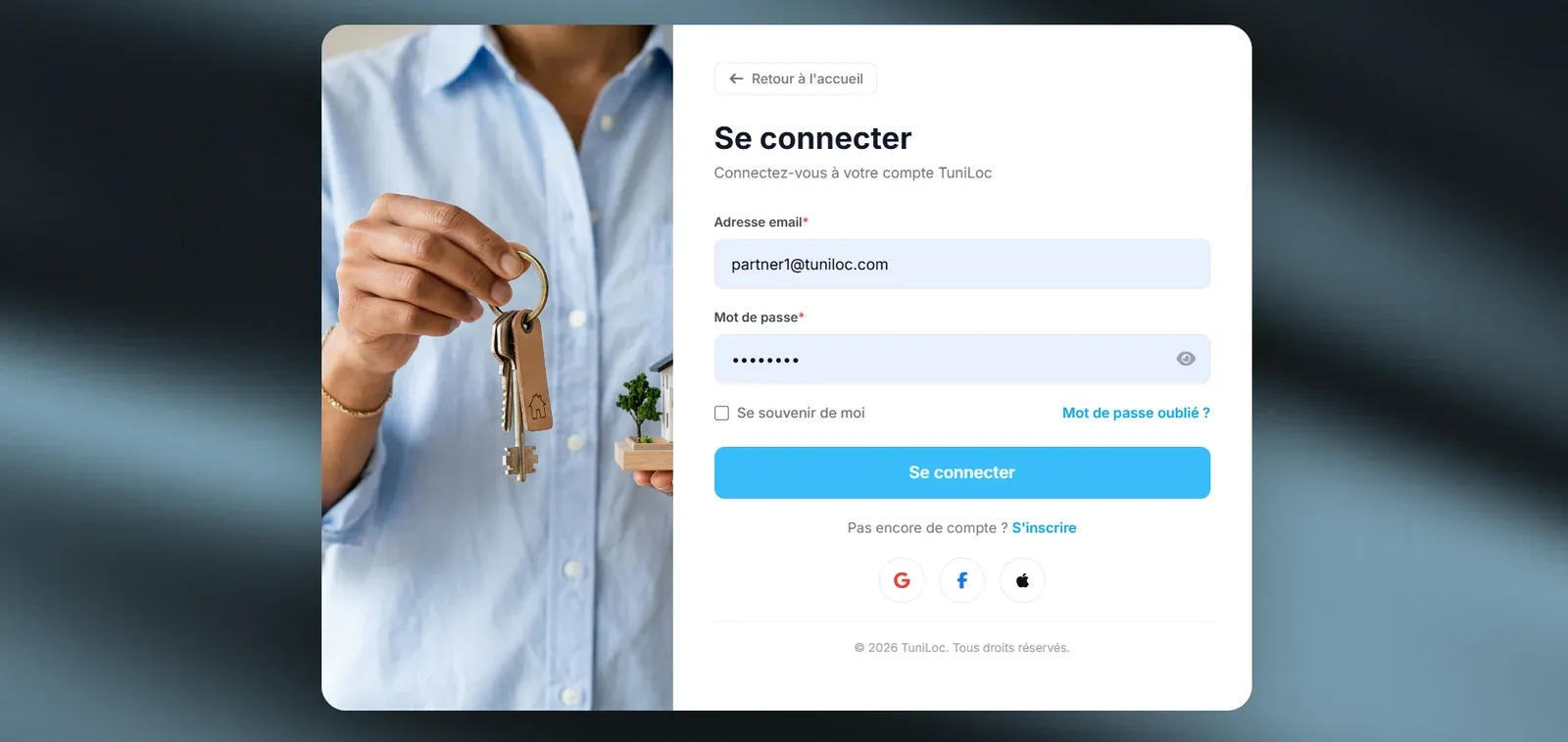 Tuniloc sign-in page: email and password form next to a photo of a hand holding keys